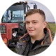AgOpen vevő portréja a traktorja mellett